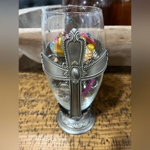 Over 65 pieces of mystery jewelry in a vintage sliver vase.